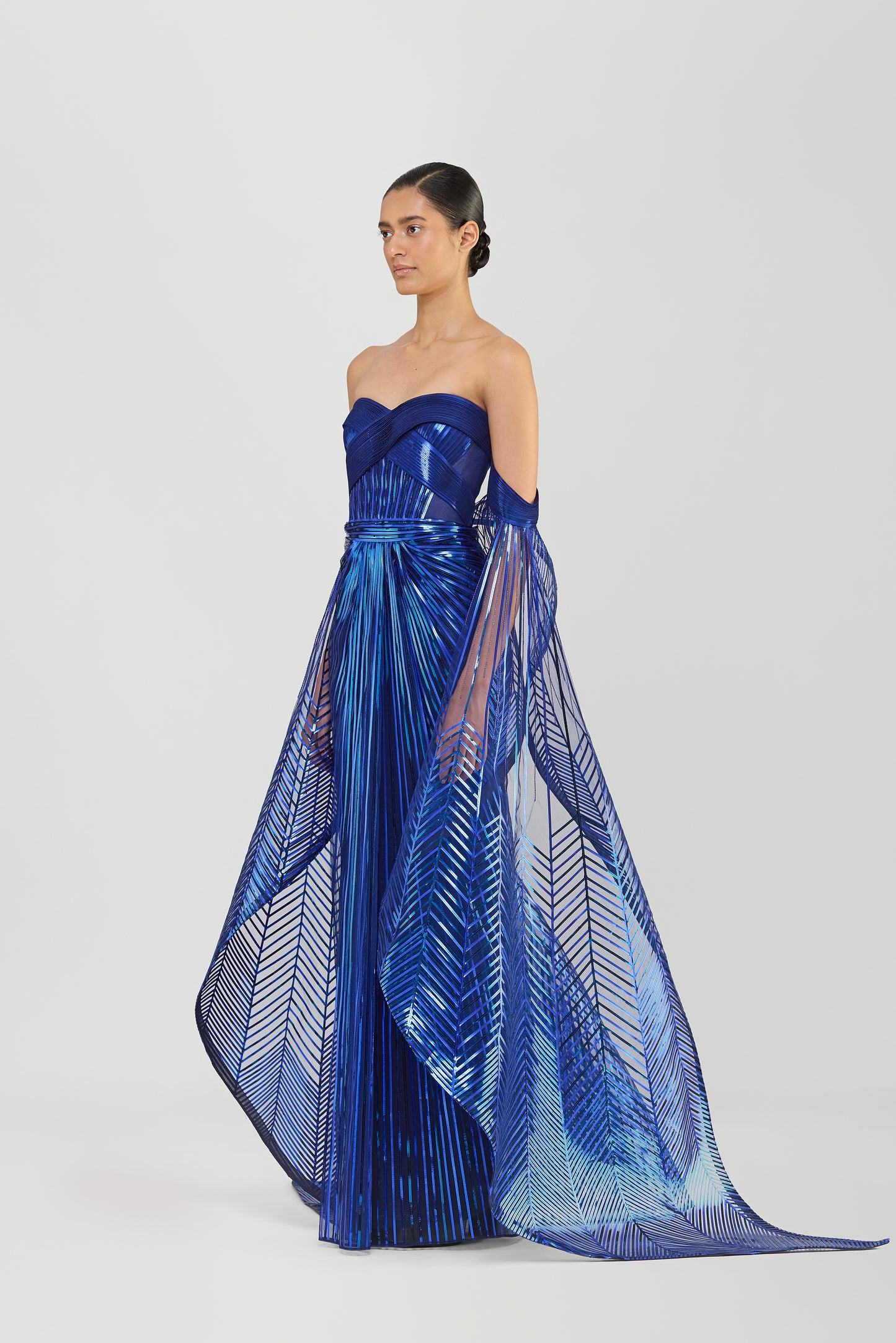 Metallic Micropleated Off The Shoulder Gown With Sunray Wings On Sleeves