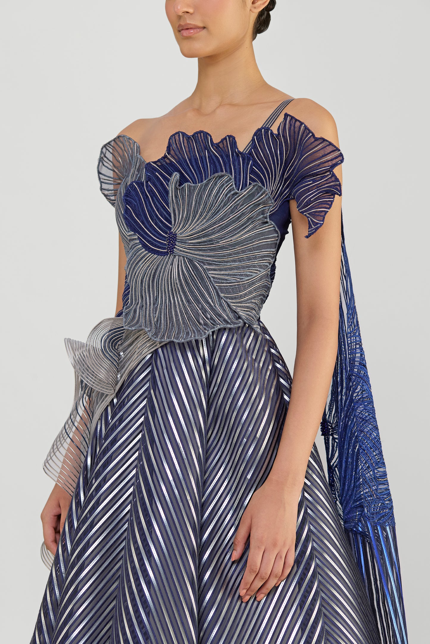 Structured Corded Coral Off The Shoulder Gown With A Metallic Fluted Tulle Skirt And Two Drapes
