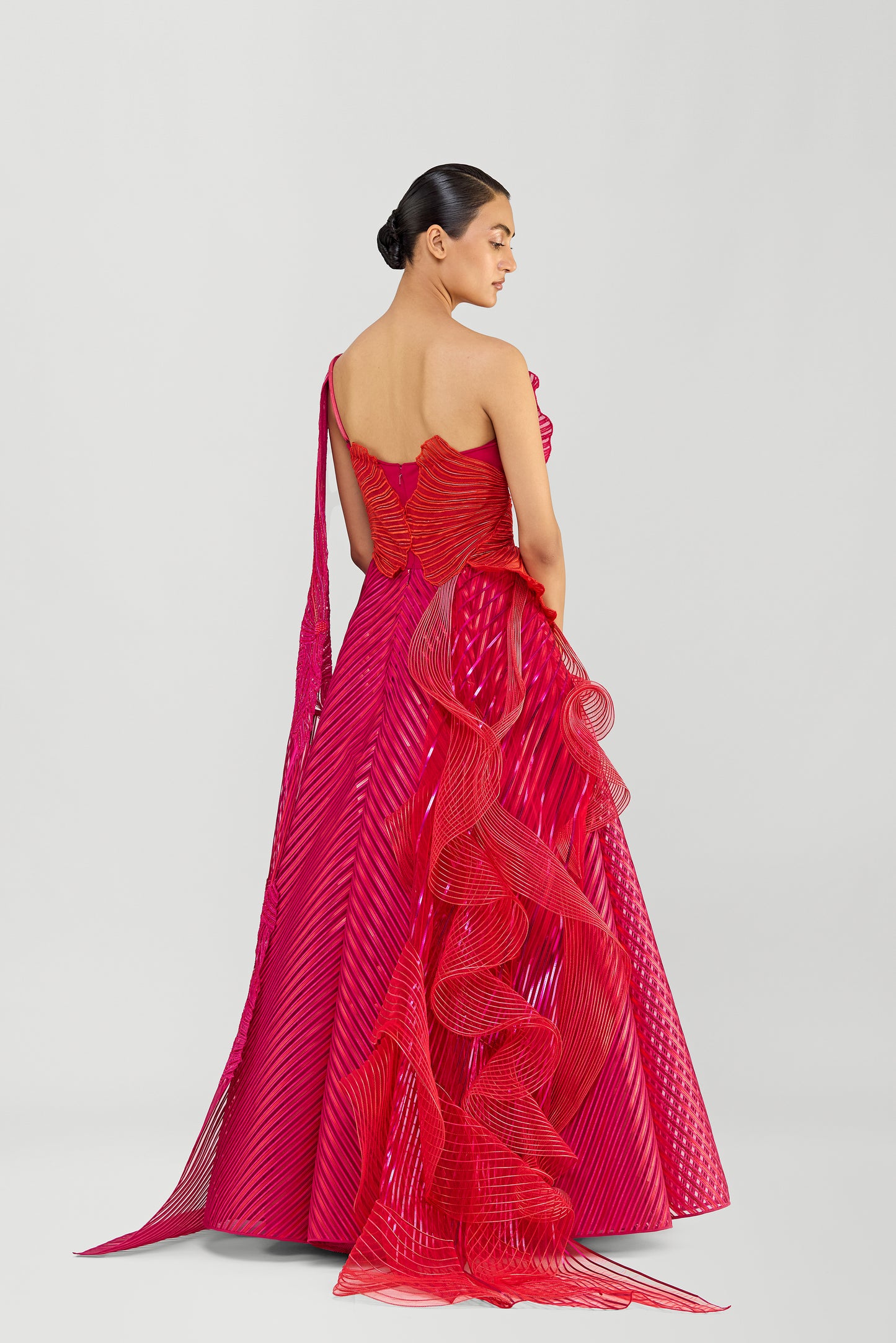 Structured Corded Coral Off The Shoulder Gown With A Metallic Fluted Tulle Skirt And Two Drapes