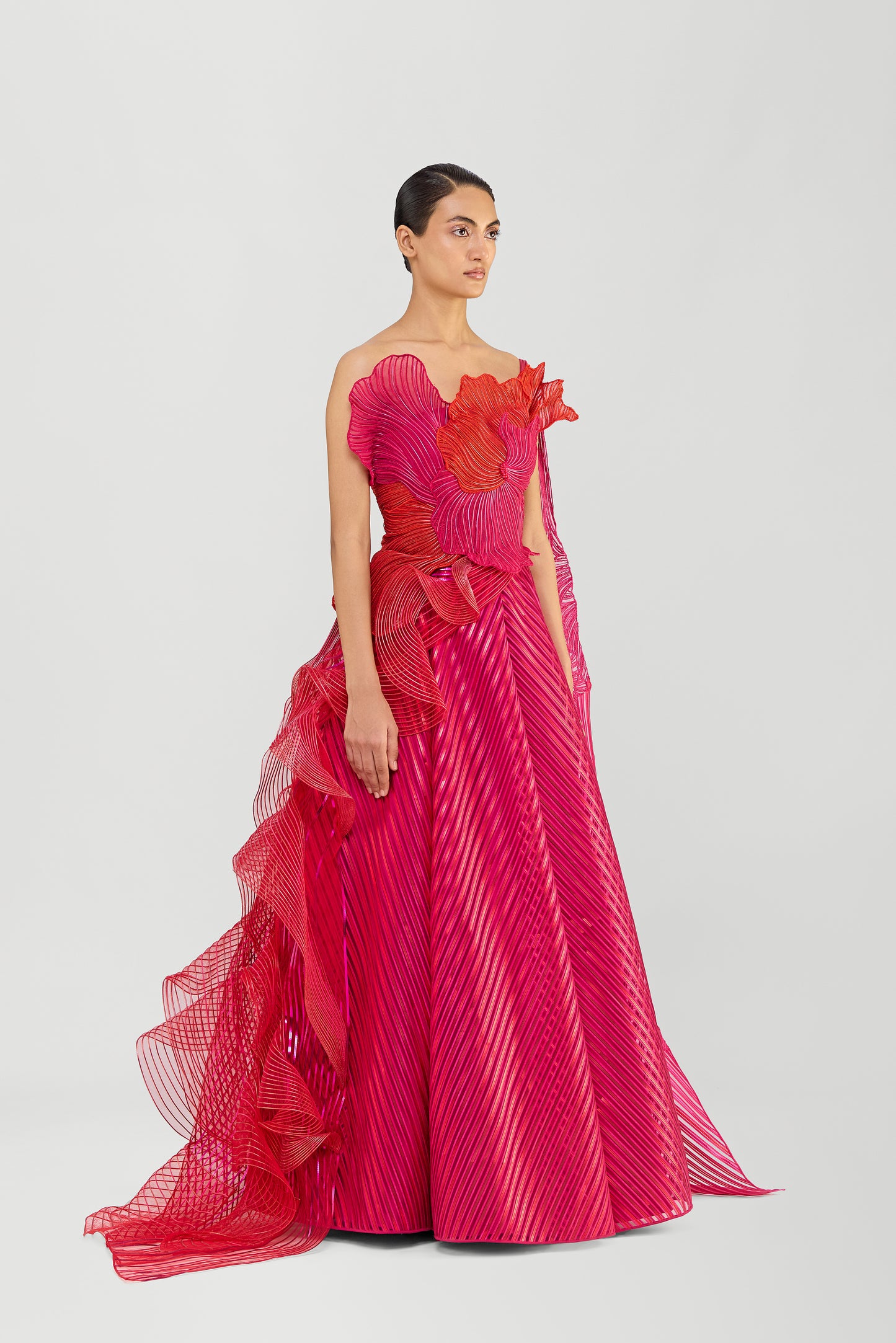 Structured Corded Coral Off The Shoulder Gown With A Metallic Fluted Tulle Skirt And Two Drapes